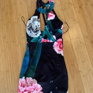 Floral and elegant dress knees length with side slit and halter neck